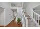 Spacious foyer with hardwood floors, staircase with white railings, and an open view of the home's interior at 1960 Barnes Mill Rd, Marietta, GA 30062