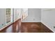Inviting living room featuring hardwood floors, large windows, and neutral wall paint at 1960 Barnes Mill Rd, Marietta, GA 30062