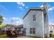 Backyard with deck and a home featuring horizontal siding under a bright blue cloudy sky at 2565 Feywood Ct, Lithonia, GA 30058