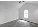 Well-lit bedroom featuring neutral walls and soft gray carpeting at 2565 Feywood Ct, Lithonia, GA 30058