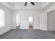 This spacious bedroom features neutral colored walls, grey carpet, and multiple doorways at 2565 Feywood Ct, Lithonia, GA 30058