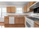 Bright kitchen featuring laminate countertops, and white appliances at 2565 Feywood Ct, Lithonia, GA 30058