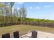 Large fenced backyard with a patio featuring outdoor seating and a view of the landscape at 269 Shoals Bridge Rd, Acworth, GA 30102