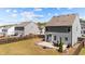 Fenced backyard features a patio, outdoor furniture, and ample green space at 269 Shoals Bridge Rd, Acworth, GA 30102