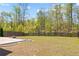 Spacious backyard with a well-maintained lawn and a classic wooden fence border at 269 Shoals Bridge Rd, Acworth, GA 30102