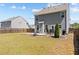 Large backyard showcasing a patio with dining furniture and a privacy fence at 269 Shoals Bridge Rd, Acworth, GA 30102
