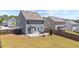 Large, private backyard has a patio with furniture and is fully fenced in at 269 Shoals Bridge Rd, Acworth, GA 30102