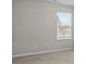 Neutral bedroom with light-filled window, and carpet floors at 269 Shoals Bridge Rd, Acworth, GA 30102