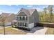 Well-maintained two-story home featuring gray siding, black shutters, and a neatly landscaped front yard at 269 Shoals Bridge Rd, Acworth, GA 30102