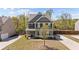 Inviting two-story home with a manicured front lawn and lovely curb appeal set against a sunny sky at 269 Shoals Bridge Rd, Acworth, GA 30102