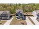 Charming two-story home with a well-maintained lawn, complemented by lush green trees in the background at 269 Shoals Bridge Rd, Acworth, GA 30102