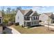 Two-story home with gray siding and a welcoming front porch, set amidst a backdrop of trees and greenery at 269 Shoals Bridge Rd, Acworth, GA 30102