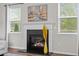 Fireplace with white mantel, flanked by windows, offering a cozy and inviting space at 269 Shoals Bridge Rd, Acworth, GA 30102