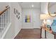 Stylish foyer with wooden floors, stairway, and tasteful decor creating a warm entrance at 269 Shoals Bridge Rd, Acworth, GA 30102