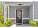 Inviting front entrance with decorative wreath, stone accents, and charming house number at 269 Shoals Bridge Rd, Acworth, GA 30102