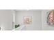 Bright hallway featuring neutral paint, modern light fixture, and decorative wall art at 269 Shoals Bridge Rd, Acworth, GA 30102
