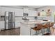Kitchen featuring stainless steel appliances, granite countertops, and an island with bar seating at 269 Shoals Bridge Rd, Acworth, GA 30102