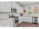 Open kitchen design with granite countertops, stainless steel appliances, and ample cabinet space at 269 Shoals Bridge Rd, Acworth, GA 30102