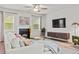 Inviting living room featuring a fireplace, television, area rug, and modern furnishings at 269 Shoals Bridge Rd, Acworth, GA 30102