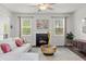 Cozy living room with a fireplace, neutral palette, and plenty of natural light at 269 Shoals Bridge Rd, Acworth, GA 30102
