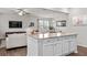 Open-concept living space showcasing a kitchen island, and seamless connection to the living room at 269 Shoals Bridge Rd, Acworth, GA 30102