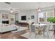 Bright and airy living space featuring a dining area, a comfortable sofa, and stylish decor at 269 Shoals Bridge Rd, Acworth, GA 30102