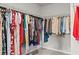 Well-organized walk-in closet with metal shelving and a variety of hanging clothes at 269 Shoals Bridge Rd, Acworth, GA 30102