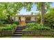 Beautiful backyard with tiered stone retaining walls, stone steps, and lush landscaping at 4 Arc Ne Way, Atlanta, GA 30305