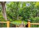 Lush backyard featuring a stone patio, a small lawn and an elegant gazebo with wooden posts and rafters at 4 Arc Ne Way, Atlanta, GA 30305