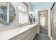Bathroom featuring a large vanity, framed mirrors, and a glass-enclosed shower at 4 Arc Ne Way, Atlanta, GA 30305