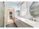 Bathroom featuring a large vanity, framed mirrors, and a glass-enclosed shower at 4 Arc Ne Way, Atlanta, GA 30305