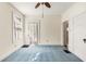 Bedroom features light blue carpet, white walls and trim, and a ceiling fan at 4 Arc Ne Way, Atlanta, GA 30305