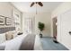 Comfortable bedroom with plush carpeting and soft, natural light from large windows at 4 Arc Ne Way, Atlanta, GA 30305