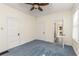 Bedroom features light blue carpet, white walls and trim, and a ceiling fan at 4 Arc Ne Way, Atlanta, GA 30305