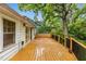 Spacious deck with built-in bench and black railing, perfect for outdoor living at 4 Arc Ne Way, Atlanta, GA 30305