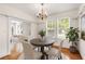 Cozy dining room featuring a traditional chandelier and ample natural light at 4 Arc Ne Way, Atlanta, GA 30305