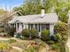 Charming home with lush landscaping, brick walkways, and an inviting front porch at 4 Arc Ne Way, Atlanta, GA 30305