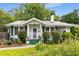 Charming home featuring a well-manicured lawn and a inviting front porch at 4 Arc Ne Way, Atlanta, GA 30305