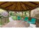 Inside of the gazebo featuring comfortable rocking chairs and view of the lush greenery outside at 4 Arc Ne Way, Atlanta, GA 30305