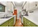 Efficient kitchen with white countertops, green cabinets, and wood floors at 4 Arc Ne Way, Atlanta, GA 30305