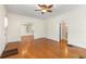 Open-concept living room with hardwood floors and access to additional rooms at 4 Arc Ne Way, Atlanta, GA 30305