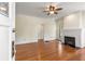 Bright living room featuring hardwood floors and a cozy brick fireplace at 4 Arc Ne Way, Atlanta, GA 30305