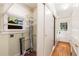 Functional mud room featuring storage cabinets, utility connections, and an exterior door at 4 Arc Ne Way, Atlanta, GA 30305