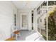 Charming screened porch featuring views of yard, white trim, and classic seating at 4 Arc Ne Way, Atlanta, GA 30305