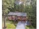 An elevated shot of a cozy home surrounded by lush, dense trees at 4020 Cranwood Dr, Atlanta, GA 30349