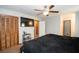 Bedroom with ceiling fan, closet and door leading to other rooms at 4020 Cranwood Dr, Atlanta, GA 30349