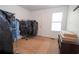 Bedroom with a window, a closet, and a light-colored carpeted floor at 4020 Cranwood Dr, Atlanta, GA 30349