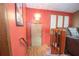 Inviting entryway featuring a staircase, wood floors, and modern light fixture at 4020 Cranwood Dr, Atlanta, GA 30349