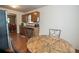 Cozy eat-in kitchen features wooden cabinets, laminate countertops and stainless steel refrigerator at 4020 Cranwood Dr, Atlanta, GA 30349