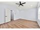 Bright bedroom features a vaulted ceiling with fan, wood floors, and a light blue painted walls at 459 Orchard Dr, Stone Mountain, GA 30083